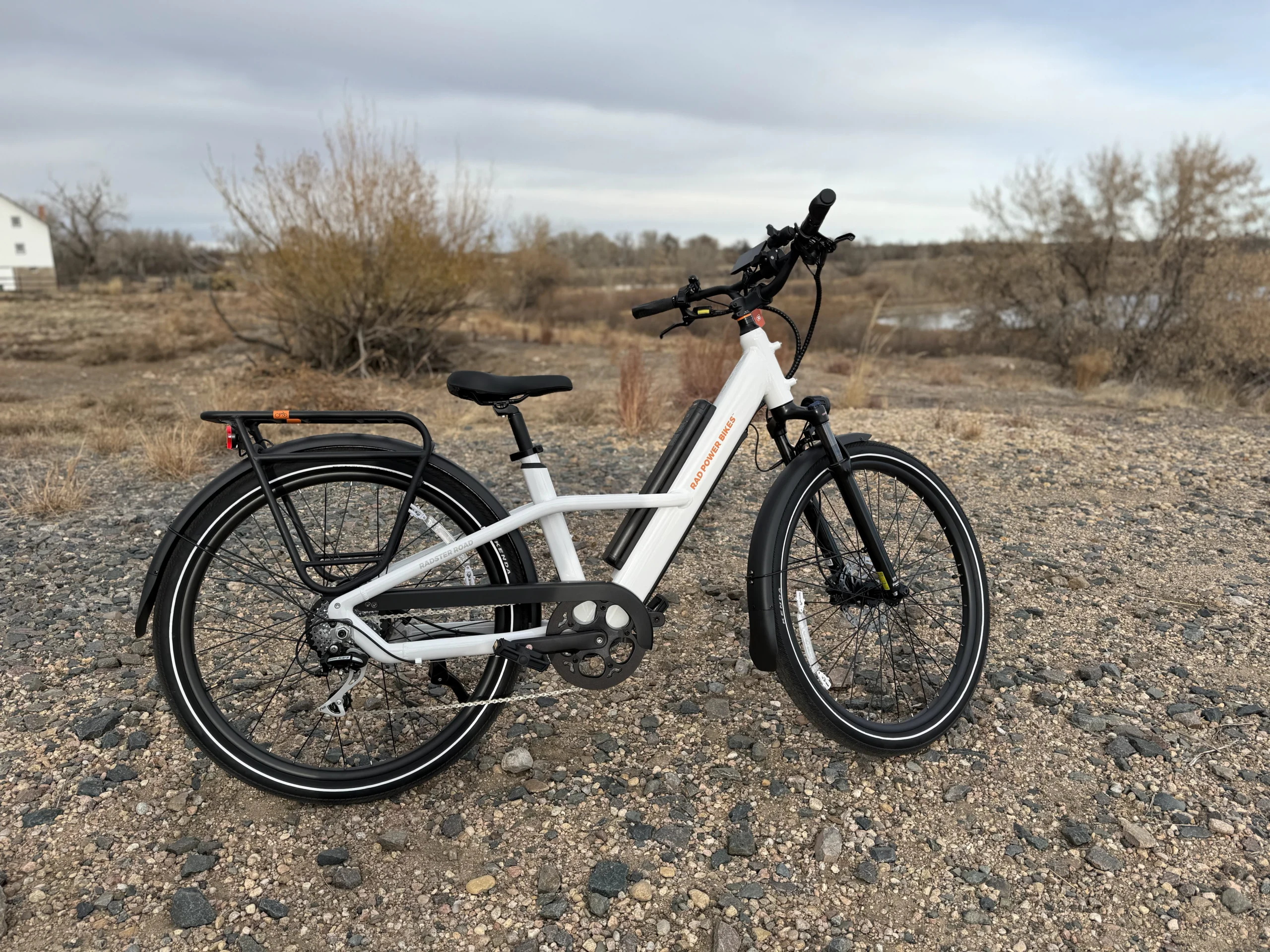 White electric bike on gravel terrain